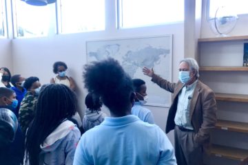 EIS Executive Director Jim Stone and EIS students, studying the map