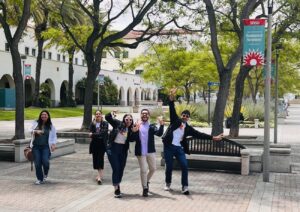 A group of YLAI participants pose while walking through the San Diego State University campus.